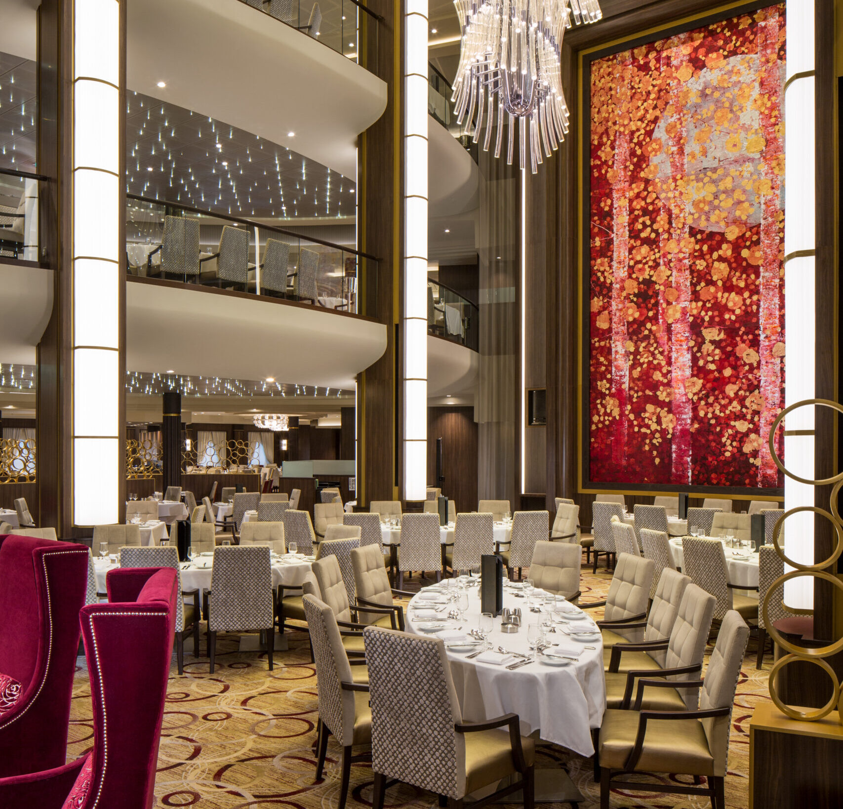 SY, Symphony of the Seas, Main Dining Room - Deck 3/4/5 Aft Center, chandelier lamp, artwork, three stories, tiers, table settings, chairs,
