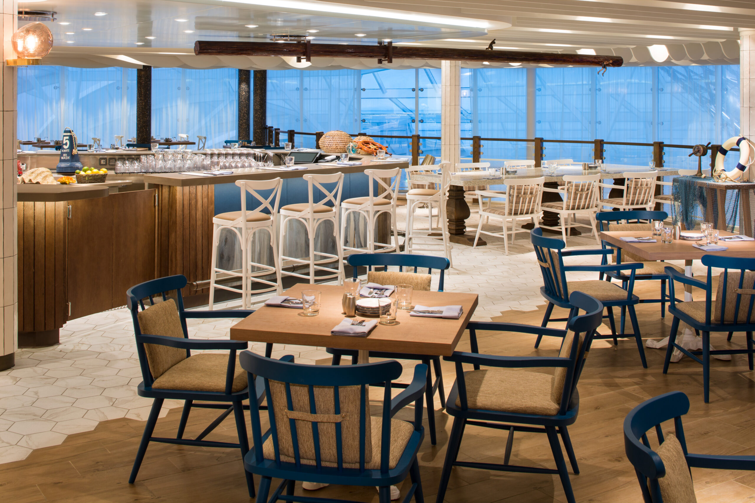 SY, Symphony of the Seas, Hooked, seafood restaurant - Deck 16 Forward Center, reataurant interior, table settings, chairs, windows, evening, dusk, nautical decor,