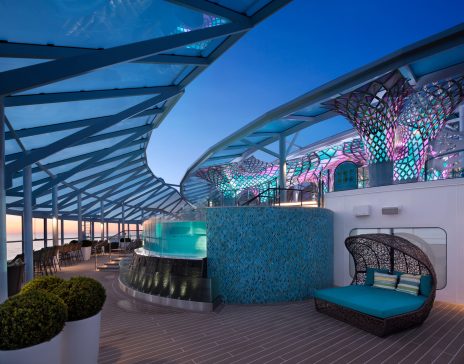 Solarium SY, Symphony of the Seas, Solarium - Deck 14/15 Forward Center, skylight, ocean view, dusk, evening, sunset, blue, colorful decor, hot tub, whirlpool, spa, Jacuzzi,